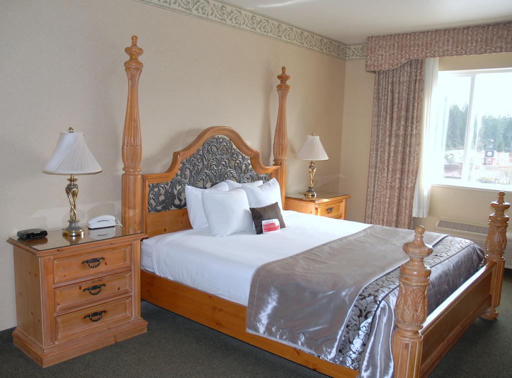 Ramada By Wyndham Olympia Hotell Rom bilde A bedroom at the Best Western Premier Hotel at Grand Country